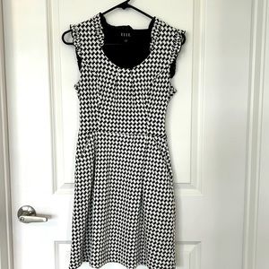 Elle black and white cocktail dress with pockets!